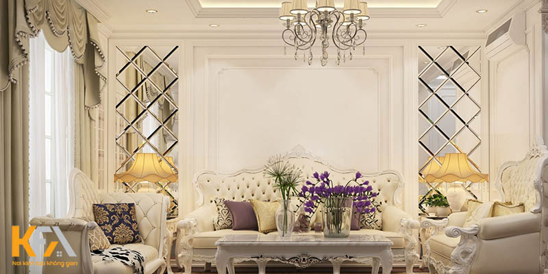 Phòng khách thiết kế theo phong cách tân cổ điển với bộ sofa trắng cách điệu cùng đèn trần sang trọng