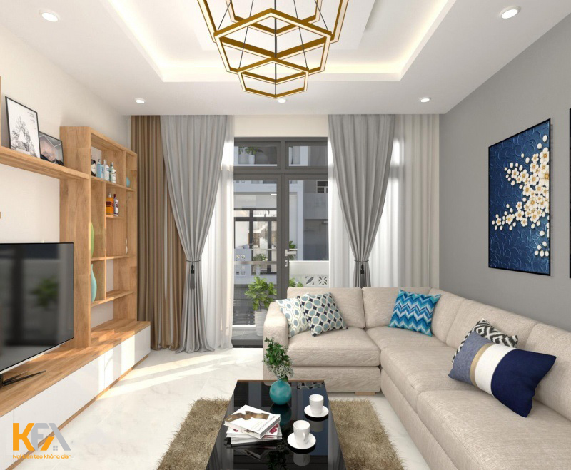 Bộ sofa màu ghi sáng với điểm nhấn là những chiếc gối họa tiết hình học phù hợp với không gian phòng khách 12m