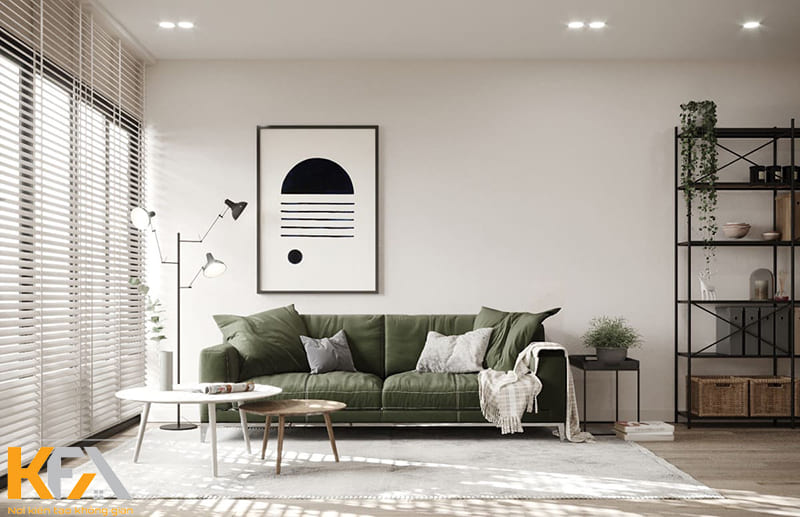 Một chiếc sofa màu xanh rêu giúp đa dạng thêm bảng màu phòng khách